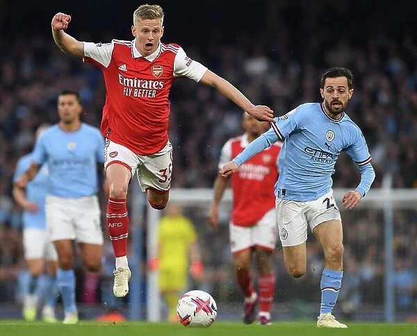 MANCHESTER, ENGLAND - APRIL 26: Oleksandr Zinchenko of Arsenal is challenged by Bernardo Silva of Manchester City during the Premier League match between Manchester City and Arsenal FC at Etihad Stadium on April 26, 2023 in Manchester, England
