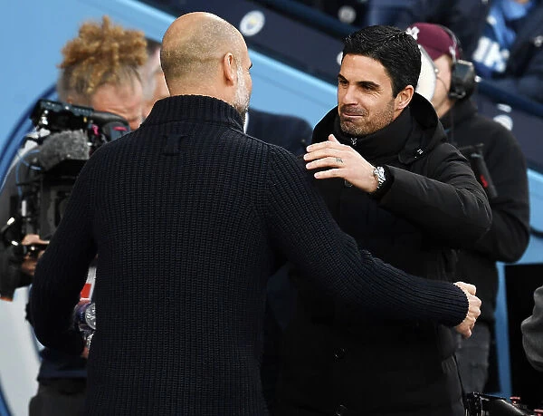 Manchester Rivalry: Mikel Arteta and Pep Guardiola Embrace Before Arsenal-Man City Clash (2022-23)