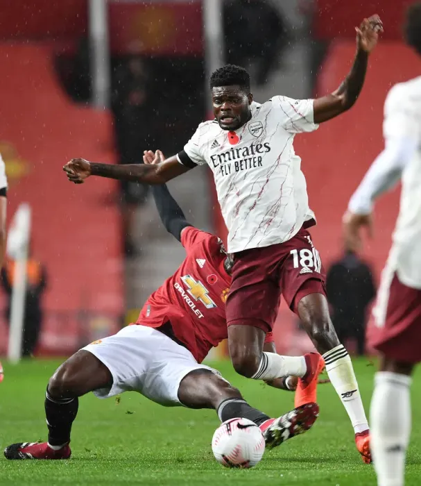 Framed Print : Manchester United vs. Arsenal: Thomas Partey Fouls by Pogba Amid Empty Old Trafford Stands (2020-21 Premier League) Framed Print : Manchester United vs. Arsenal: Thomas Partey Fouls by Pogba Amid Empty Old Trafford Stands (2020-21 Premier League)