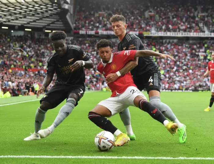 Framed Print : Manchester United vs. Arsenal: Bukayo Saka and Ben White Clash Against Jadon Sancho in 2022-23 Premier League Showdown