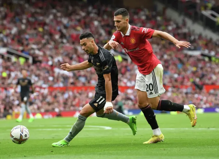 Framed Print : Manchester United vs Arsenal: Gabriel Martinelli Faces Off Against Diogo Dalot in Premier League Clash (2022-23)