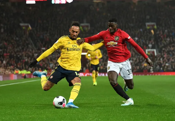 Framed Print : Manchester United vs. Arsenal: Aubameyang Faces Off Against Tuanzebe in Premier League Clash Framed Print : Manchester United vs. Arsenal: Aubameyang Faces Off Against Tuanzebe in Premier League Clash