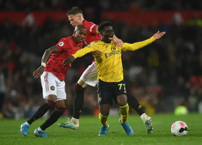 Framed Print : Manchester United vs. Arsenal: Bukayo Saka Fouls by McTominay in 2019-20 Premier League Clash Framed Print : Manchester United vs. Arsenal: Bukayo Saka Fouls by McTominay in 2019-20 Premier League Clash
