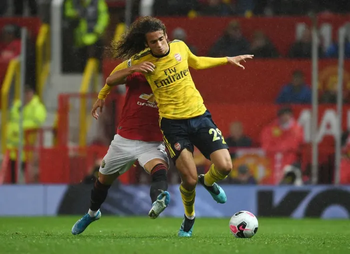 Framed Print : Manchester United vs. Arsenal: Guendouzi vs. Pereira Clash in Premier League Showdown Framed Print : Manchester United vs. Arsenal: Guendouzi vs. Pereira Clash in Premier League Showdown