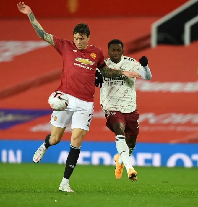 Framed Print : Manchester United vs Arsenal: Nketiah vs Lindelof Clash in Empty Old Trafford, Premier League 2020-21 Framed Print : Manchester United vs Arsenal: Nketiah vs Lindelof Clash in Empty Old Trafford, Premier League 2020-21