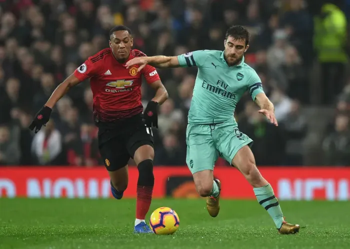 Framed Print : Manchester United vs. Arsenal: Sokratis vs. Anthony Martial - Intense Battle in the Premier League