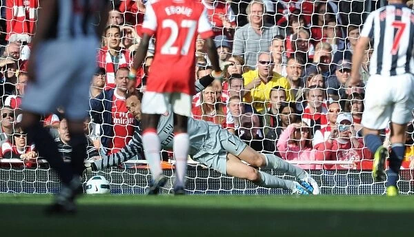 Manuel Almunia (Arsenal) saves the West Brom penalty taken by Chris Brunt