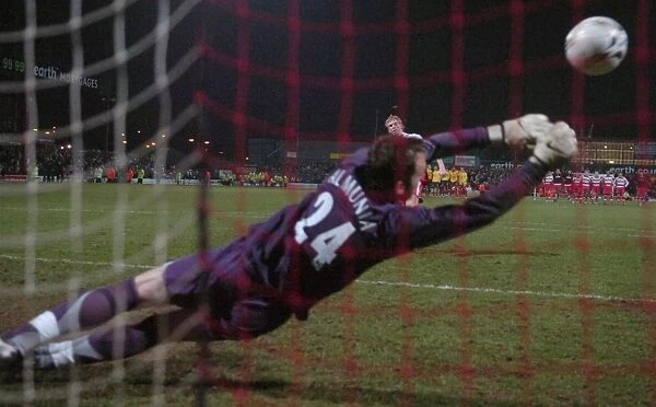I. Manuel Almunia saves Doncasters 4th penalty during the penalty shoot out