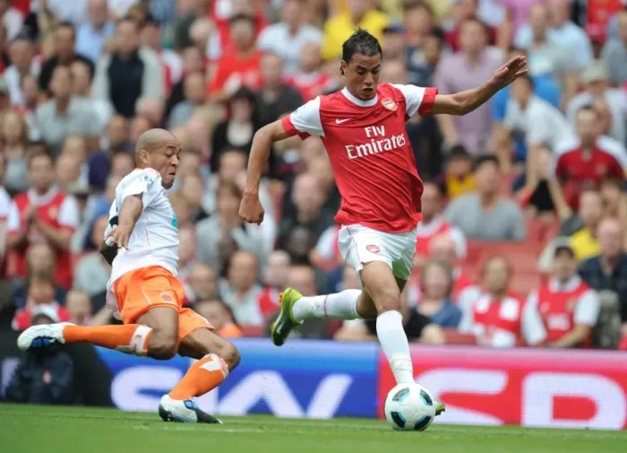 Framed Print : Marouane Chamakh (Arsenal) Alex Baptiste (Blackpool). Arsenal 6: 0 Blackpool