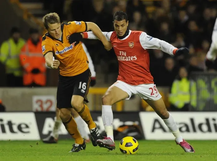 Framed Print : Marouane Chamakh (Arsenal) Christophe Berra (Wolves). Wolverhampton Wanderers 0: 2 Arsenal