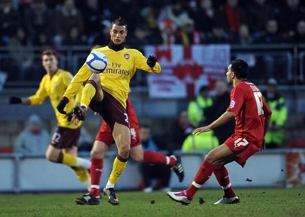 Marouane Chamakh (Arsenal) Jason Crowe (Orient). Leyton Orient 1: 1 Arsenal