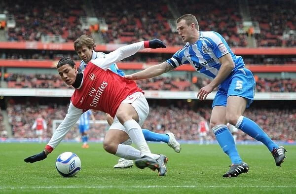 Marouane Chamakh (Arsenal) Peter Clarke (Huddersfield). Arsenal 2:1 Huddersfield Town