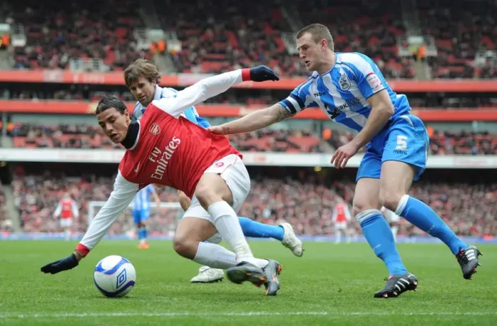 Framed Print : Marouane Chamakh (Arsenal) Peter Clarke (Huddersfield). Arsenal 2: 1 Huddersfield Town