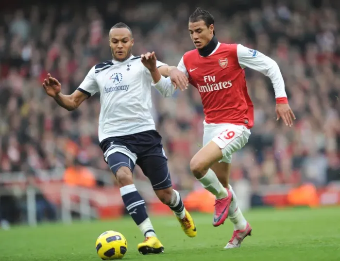 Framed Print : Marouane Chamakh (Arsenal) Younes Kaboul (Tottenham). Arsenal 2: 3 Tottenham Hotspur