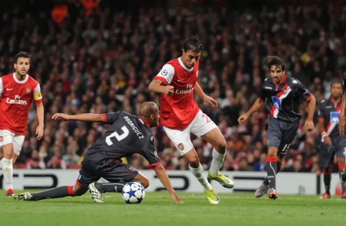 Framed Print : Marouane Chamakh breaks past Braga defender Alberto Rodriguez to score the 3rd Arsenal goal