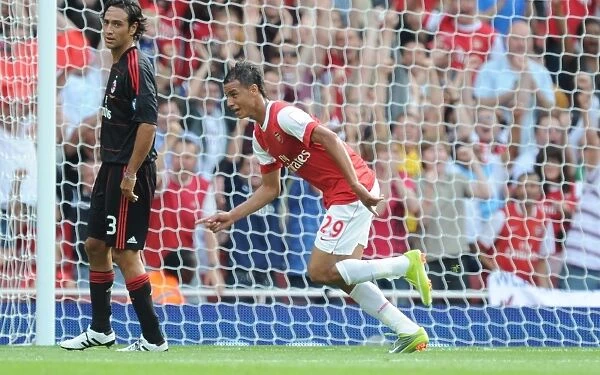 Marouane Chamakh celebrates scoring Arsenals goal. Arsenal 1: 1 AC Milan