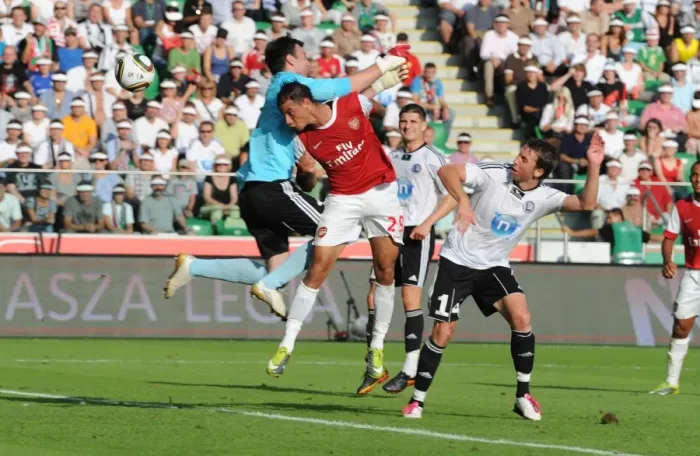 Framed Print : Marouane Chamakh heads past Leiga goalkeeper Marijan Antolovic to score the 1st Arsenal goal