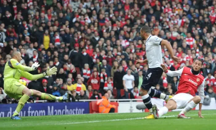 Framed Print : Marouane Chamakh scores Arsenals 2nd goal under pressure from Younes Kaboul Framed Print : Marouane Chamakh scores Arsenals 2nd goal under pressure from Younes Kaboul