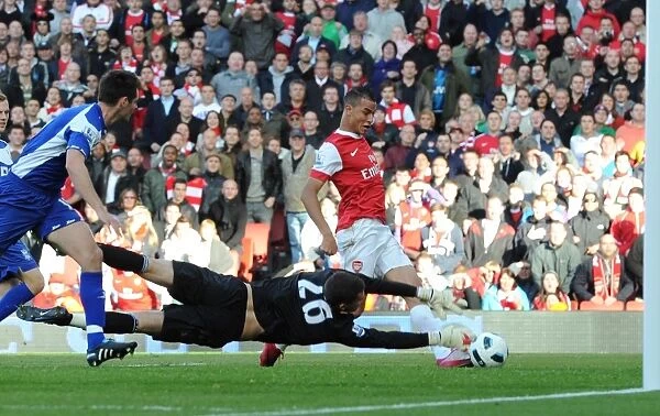 Marouane Chamakh shoots past Birmingham goalkeeper Ben Foster to score the 2nd Arsenal goal