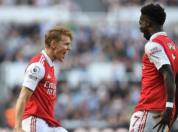Martin Odegaard and Bukayo Saka Celebrate Arsenal's First Goal Against Newcastle United in 2022-23 Premier League