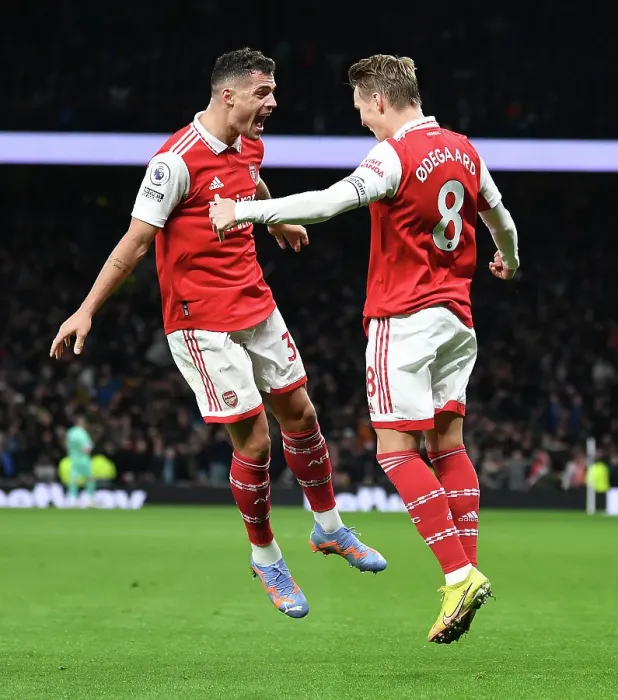 Framed Print : Martin Odegaard and Granit Xhaka Celebrate Arsenal's Winning Goal Against Tottenham Hotspur (2022-23)