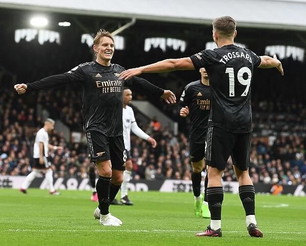Martin Odegaard and Leandro Trossard Celebrate Arsenal's Third Goal vs Fulham (2022-23)