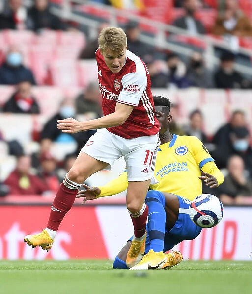 Martin Odegaard Scores Past Bissouma: Arsenal's Thrilling Victory Over Brighton in the 2020-21 Premier League