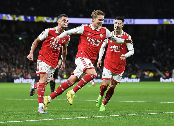 Martin Odegaard and Teammates Celebrate as Arsenal Take a 2-0 Lead Over Tottenham Hotspur in the Premier League