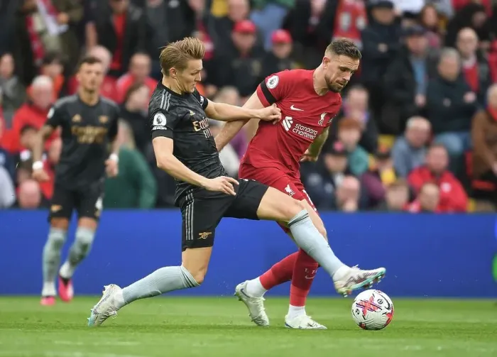 Framed Print : Martin Odegaard vs. Jordan Henderson: A Premier League Battle at Anfield, 2022-23