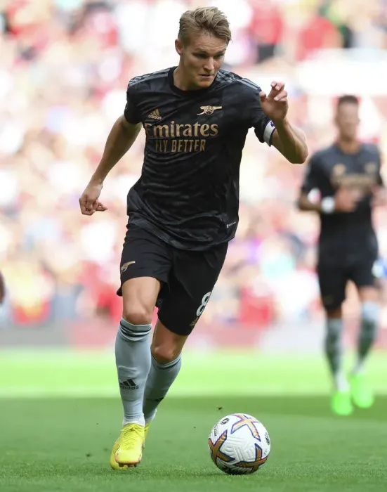 Framed Print : Martin Odegaard vs Manchester United: Arsenal's Midfield Maestro Clashes with Rivals in Premier League Showdown (2022-23)