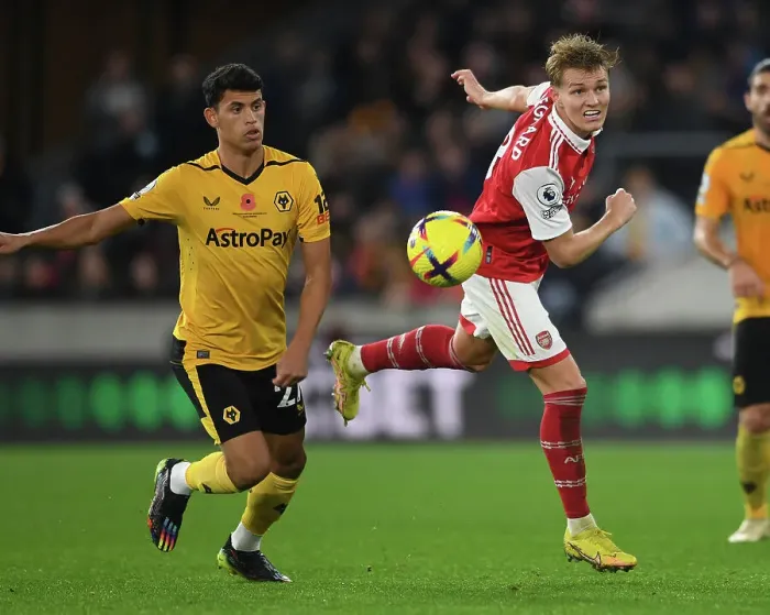 Framed Print : Martin Odegaard vs. Matheus Nunes: Heading Battle at Molineux - Wolverhampton Wanderers vs. Arsenal FC, Premier League 2022-23
