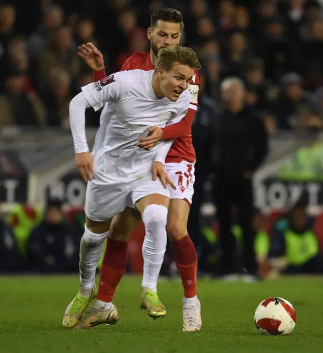 Framed Print : Martin Odegaard vs Philip Zinckernagel: A Battle in the FA Cup Third Round Clash Between Nottingham Forest and Arsenal Framed Print : Martin Odegaard vs Philip Zinckernagel: A Battle in the FA Cup Third Round Clash Between Nottingham Forest and Arsenal