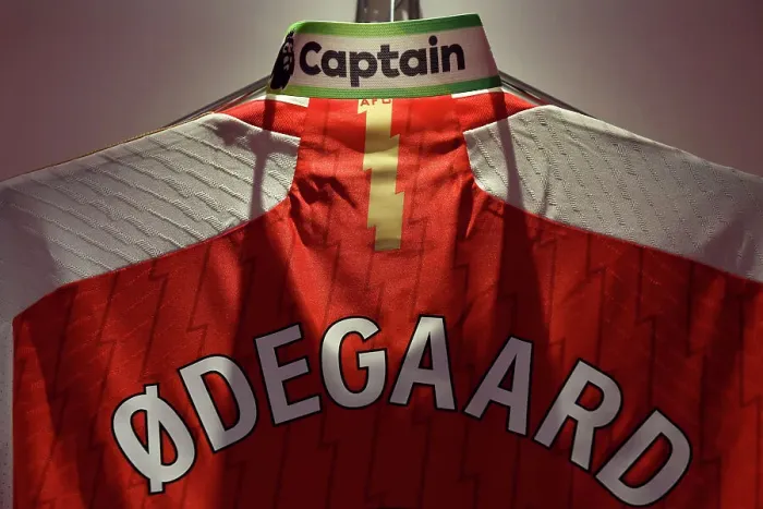 Framed Print : Martin Odegaard's Arsenal Captaincy: Armband and Shirt in Arsenal Dressing Room (2023-24) Framed Print : Martin Odegaard's Arsenal Captaincy: Armband and Shirt in Arsenal Dressing Room (2023-24)