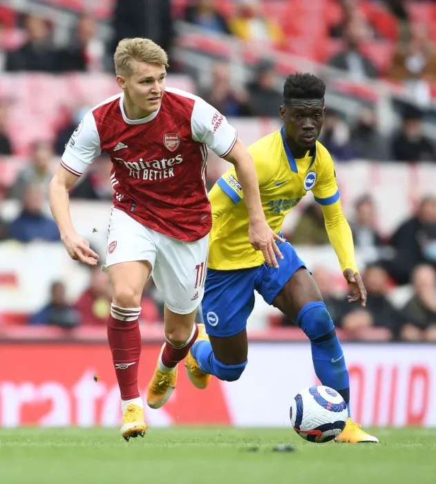 Framed Print : Martin Odegaard's Thrilling Goal: Arsenal Secure Victory Over Brighton at Emirates Stadium
