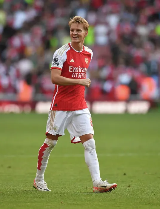 Framed Print : Martin Odegaard's Thrilling Victory Celebration: Arsenal's Triumph Over Manchester United (2023-24 Premier League)