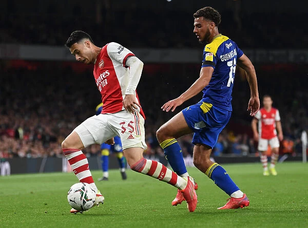 Martinelli Clashes with Guinness-Walker: Arsenal vs AFC Wimbledon in Carabao Cup