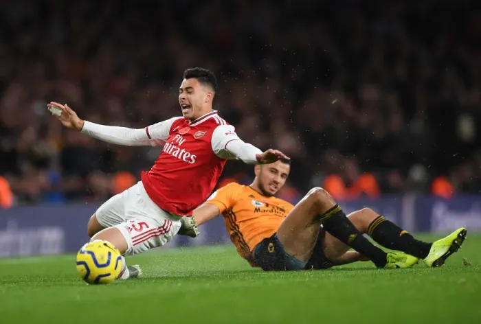 Framed Print : Martinelli Foul: Arsenal's Rising Star Halted by Saiss in Arsenal vs. Wolverhampton (2019-20) Framed Print : Martinelli Foul: Arsenal's Rising Star Halted by Saiss in Arsenal vs. Wolverhampton (2019-20)