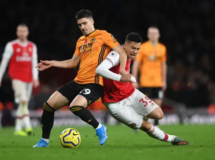 Framed Print : Martinelli Foul: Arsenal's Star Forward Halted by Vinagre in Arsenal vs. Wolverhampton Clash (November 2019)
