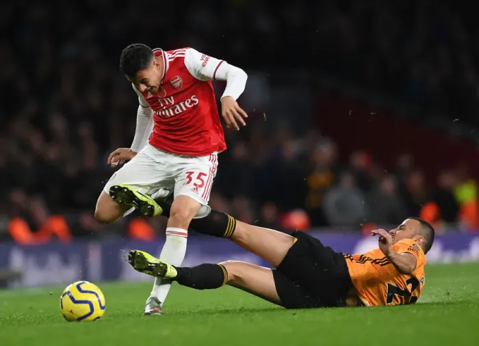 Framed Print : Martinelli Fouled by Saiss in Arsenal vs. Wolverhampton (2019-20 Premier League) Framed Print : Martinelli Fouled by Saiss in Arsenal vs. Wolverhampton (2019-20 Premier League)