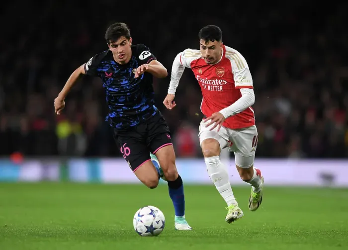 Framed Print : Martinelli Under Pressure: Arsenal's Battle Against Sevilla in Champions League Framed Print : Martinelli Under Pressure: Arsenal's Battle Against Sevilla in Champions League