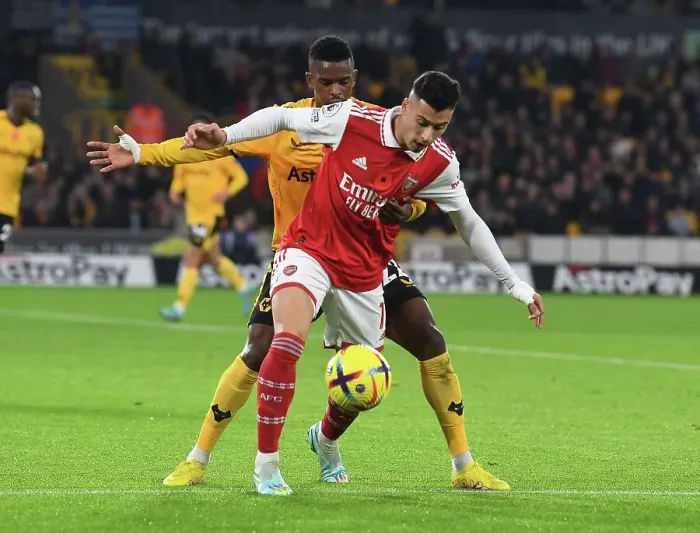 Framed Print : Martinelli Stands Firm: Arsenal's Determined Battle at Molineux against Wolverhampton Wanderers, Premier League 2022-23