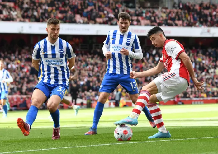 Framed Print : Martinelli Stands Firm Against Brighton Duo in Arsenal's Premier League Clash