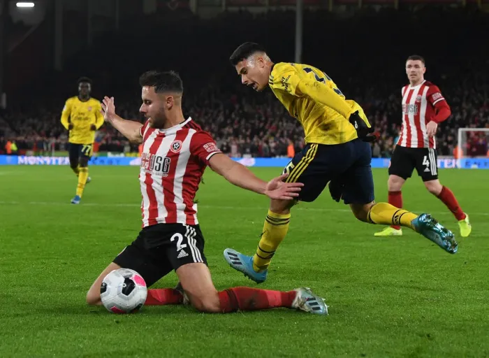 Framed Print : Martinelli vs Baldock: Clash at Bramall Lane - Sheffield United vs Arsenal, Premier League 2019-20 Framed Print : Martinelli vs Baldock: Clash at Bramall Lane - Sheffield United vs Arsenal, Premier League 2019-20