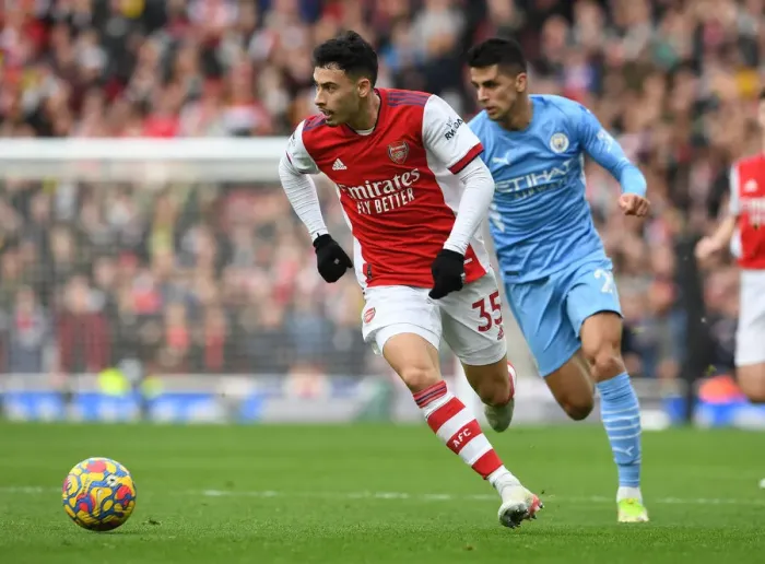 Framed Print : Martinelli vs. Cancelo: A Fiery Face-Off in Arsenal's Battle against Manchester City Framed Print : Martinelli vs. Cancelo: A Fiery Face-Off in Arsenal's Battle against Manchester City