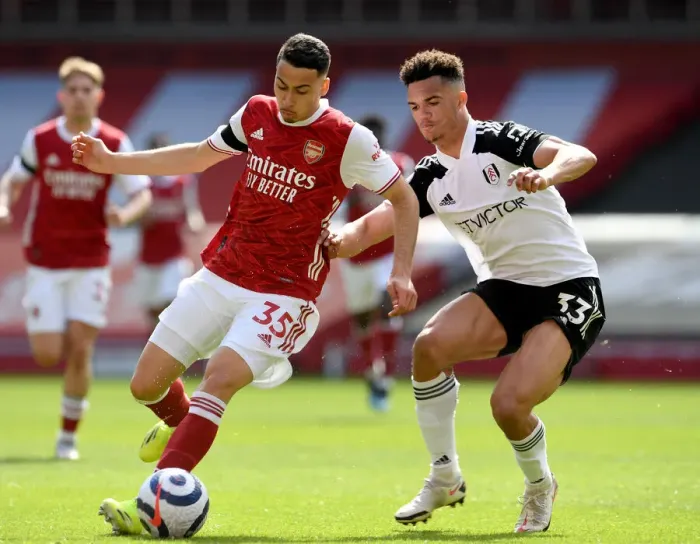 Framed Print : Martinelli vs. Robinson: A Rivalry Unfolds in Empty Emirates Stadium - Arsenal vs. Fulham, Premier League 2020-21