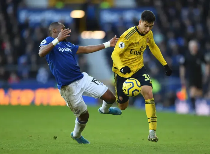 Framed Print : Martinelli vs Sidibe: Clash at Goodison Park - Everton vs Arsenal, Premier League 2019-20
