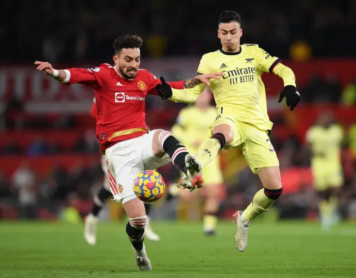 Framed Print : Martinelli vs Telles: A Premier League Battle at Old Trafford Framed Print : Martinelli vs Telles: A Premier League Battle at Old Trafford