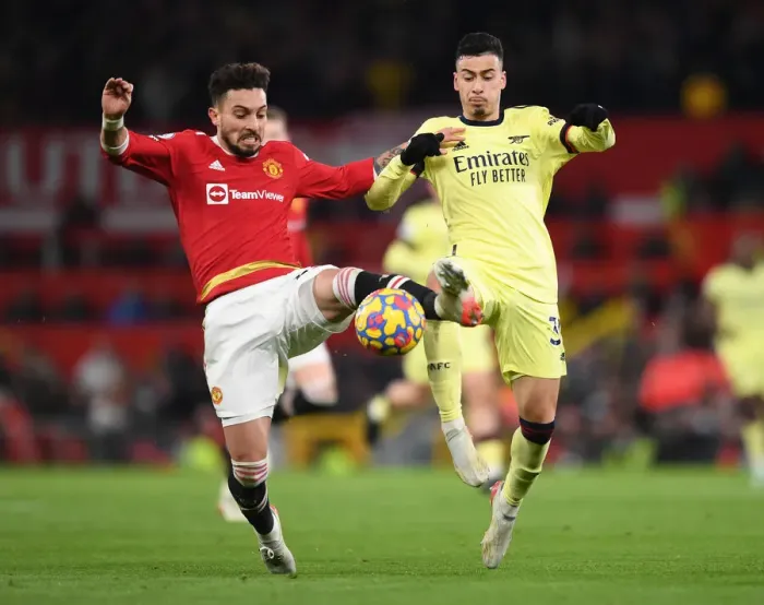Framed Print : Martinelli vs. Telles: A Wingers Battle at Old Trafford - Premier League 2021