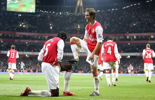 Mathieu Flamini celebrates scoring the 2nd Arsenal goal with Emmanuel Adebayor