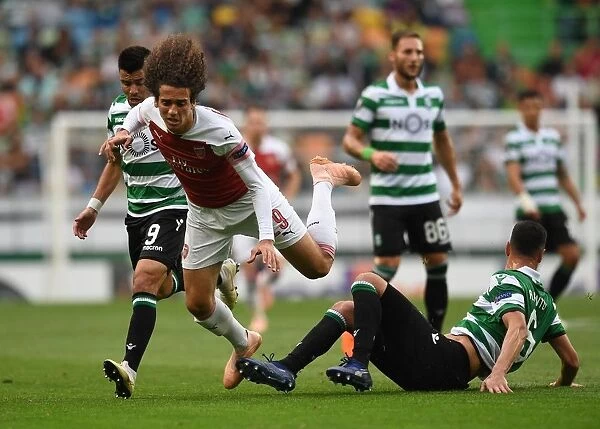 Matteo Guendouzi vs. Andre Pinto: Battle for Ball Possession in Arsenal's Europa League Clash with Sporting Lisbon
